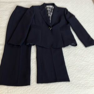 Fabulous navy Tahari suit. Great pleating detail on jacket and lined pants